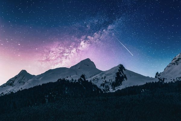 Snow-capped peak milky way